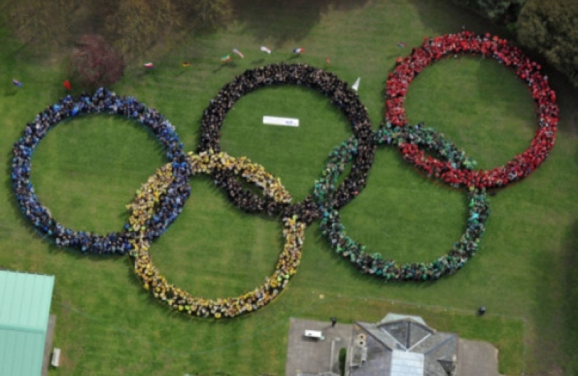 IMPRESSIVE Pupils and staff form the Olympic rings. Picture: Steve Reid